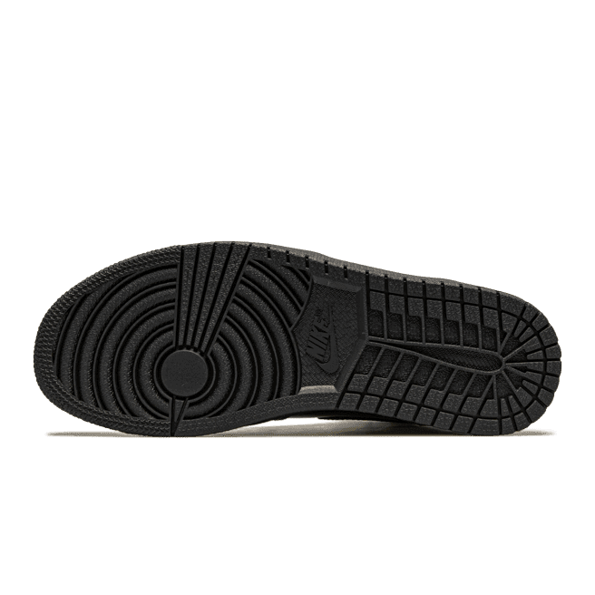 Air Jordan 1 High Black Metallic Gold sneakers van Nike op een donkergroene achtergrond