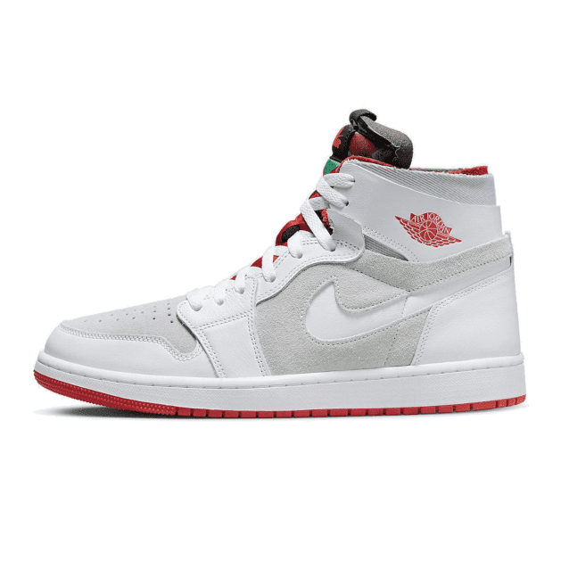 Witte en rode Nike Air Jordan 1 High Zoom Air CMFT sneakers op een groene achtergrond