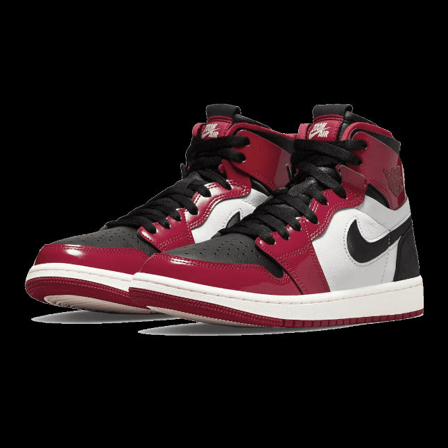 Rode Nike Air Jordan 1 High Zoom CMFT Patent sneakers tegen een effen groene achtergrond geplaatst