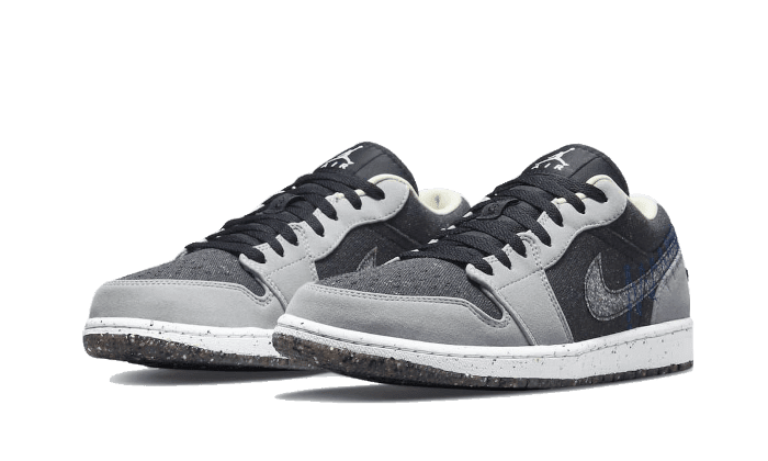 Stijlvolle Nike Air Jordan 1 Low Crater sneakers in zwart en grijs. Deze duurzame schoenen belichamen de klassieke Jordan-look met een moderne, milieubewuste twist. Perfect voor zowel casual als fashionable outfits.