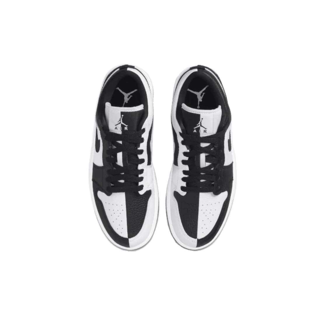 Elegante Nike Air Jordan 1 Low SE Homage sneakers op een groene achtergrond