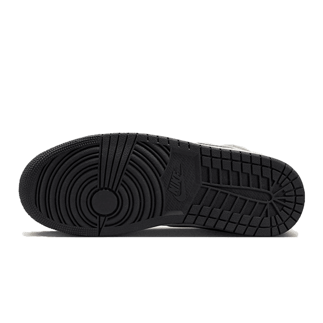 Bruin gestippelde Nike sneakers met opvallende zool in zwart-wit contrast