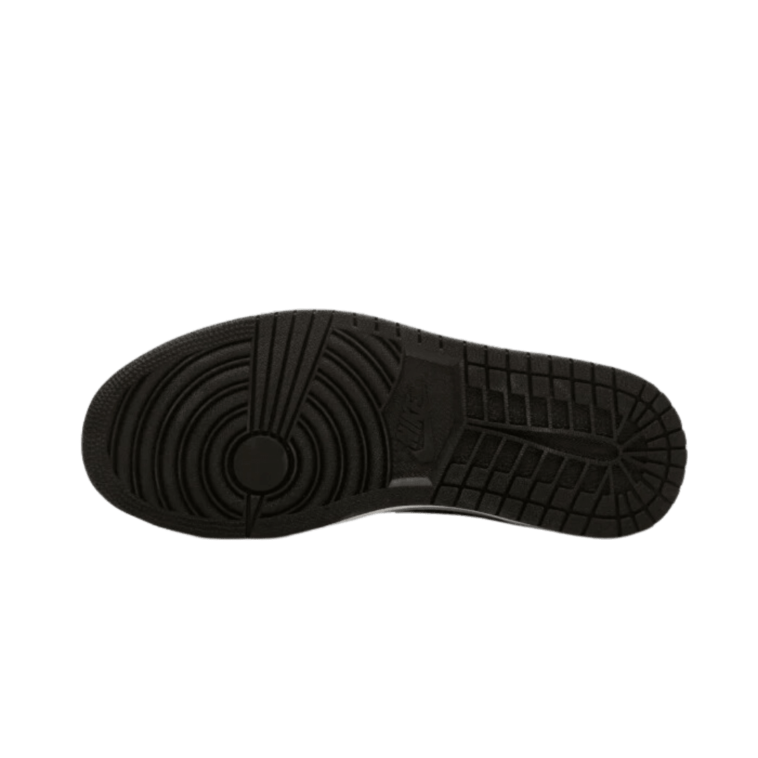 Zwarte rubberen zool van Nike Air Jordan 1 Mid SE Union Black Toe-sneaker op groene achtergrond