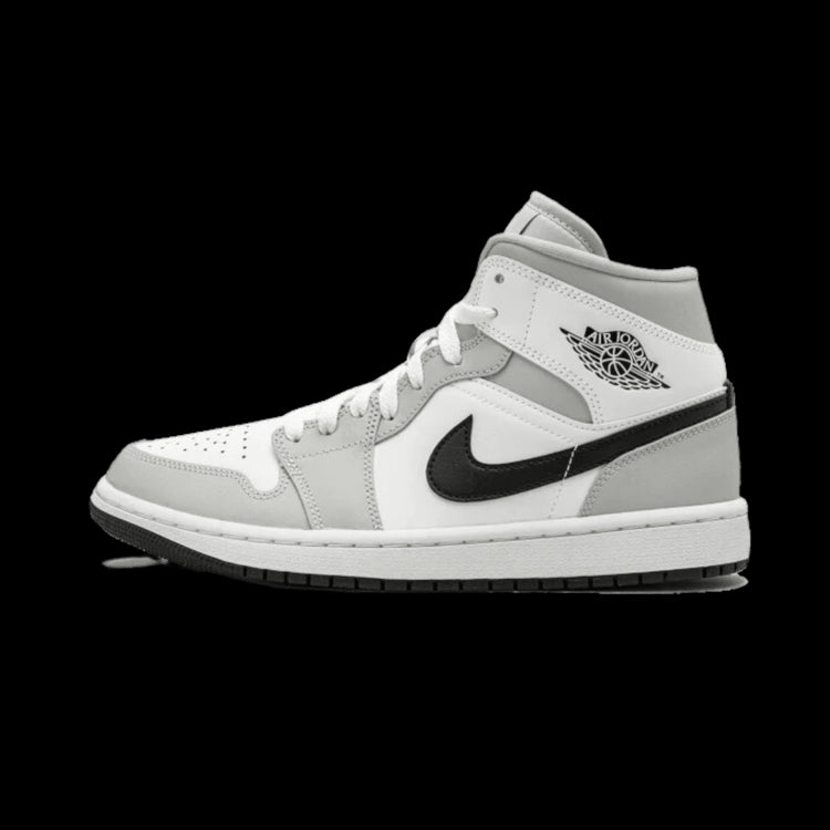 Exclusieve Nike Air Jordan 1 Mid sneakers in wit en licht grijze kleurstelling, met kenmerkende Nike Swoosh logo op de zijkant. Deze klassieke sportieve sneakers zijn geschikt voor dagelijks gebruik en bieden comfort en stijl.