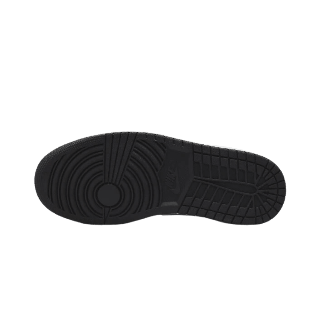 Zwarte sneakerzool met opvallend patroon op groene achtergrond