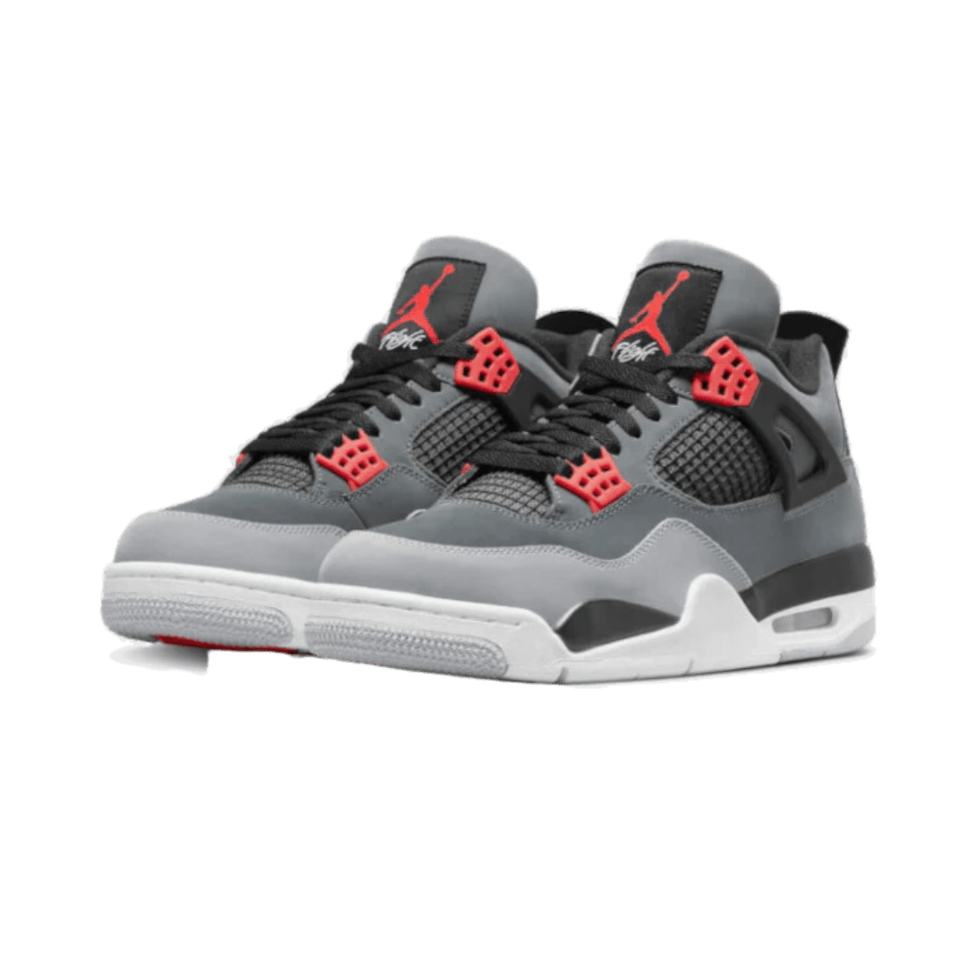 Veelzijdige Air Jordan 4 Infrared (2022) sneakers op groene achtergrond