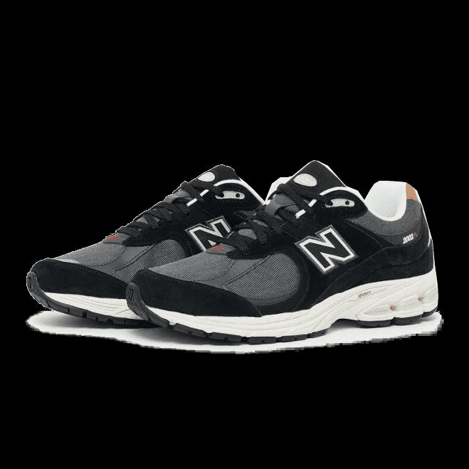 Stijlvolle New Balance 2002R sneakers in zwart-grijs met het New Balance-logo