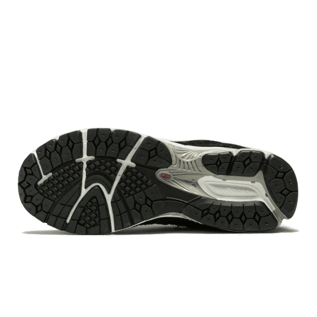 Zwarte New Balance 2002R Protection Pack sneakers met een grijze zool en ondergrond