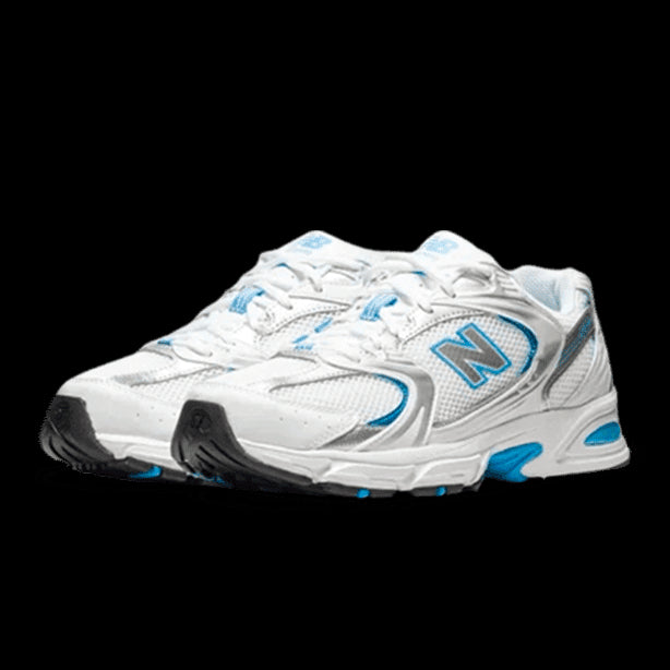 Witte New Balance 530-sneakers met luchtblauwe accenten