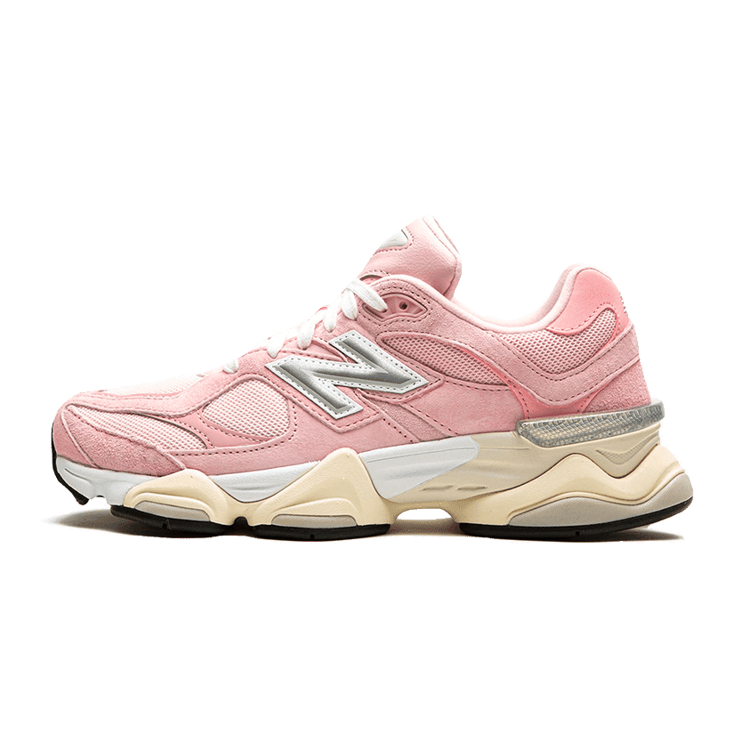 Stylish New Balance 9060 crystal pink sneakers on a solid green background