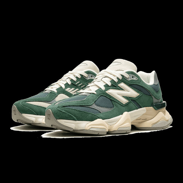 Sleek forest green New Balance 9060 sneakers on a plain background