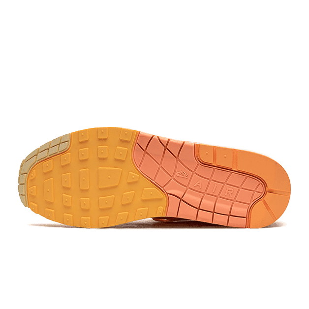 Sneaker oranje-gele tred met flexibele rubberen zool - Nike Air Max 1 Puerto Rico Orange Frost WOOVIN2024 sneaker van Sole Central, jouw bestemming voor exclusieve sneakers.