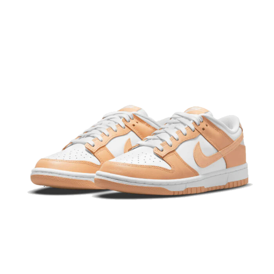 Stylish Nike Dunk Low Harvest Moon sneakers in off-white and peach hues, featuring a sleek design and textured panels for a modern aesthetic.